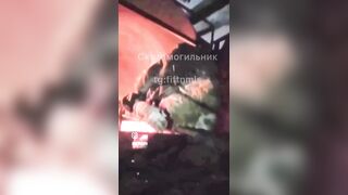 Ukrainians burn the rotting corpses of their comrades.