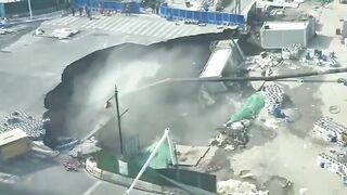 A massive sinkhole has swallowed a road in Shanghai