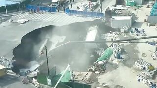 A massive sinkhole has swallowed a road in Shanghai