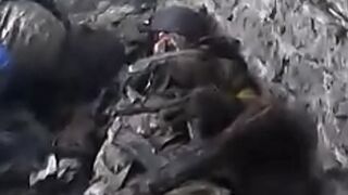 Dead soldiers after the massacre in the village of Georgievka
