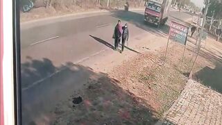 Two Jaywalkers Taken Out By Speeding Truck In India