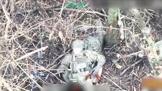 A Ukrainian paratrooper hits a Russian soldier who was trying to throw a grenade