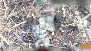 A Ukrainian paratrooper hits a Russian soldier who was trying to throw a grenade