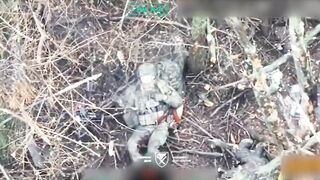 A Ukrainian paratrooper hits a Russian soldier who was trying to throw a grenade