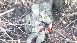 A Ukrainian paratrooper hits a Russian soldier who was trying to throw a grenade