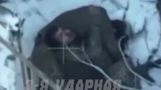 Colombian mercenary dies embracing his dead comrade.