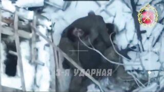Colombian mercenary dies embracing his dead comrade.