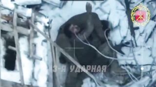 Colombian mercenary dies embracing his dead comrade.