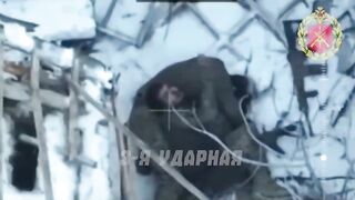 Colombian mercenary dies embracing his dead comrade.
