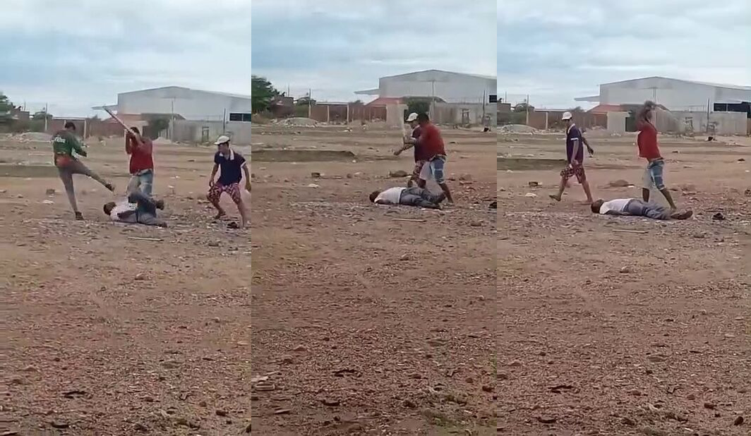 A man is brutally beaten with kicks and blows from a stick in Brazil.