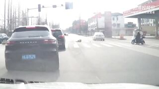 Dumb Moped Rider Pays The Price For Running On A Red Light