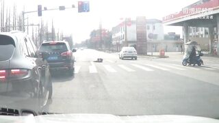 Dumb Moped Rider Pays The Price For Running On A Red Light