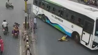 Man Gets Run Over By Bus On  Busy Road In India