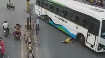 Man Gets Run Over By Bus On  Busy Road In India