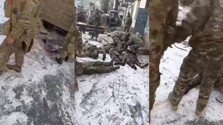 A Russian soldier is showing his dead friends