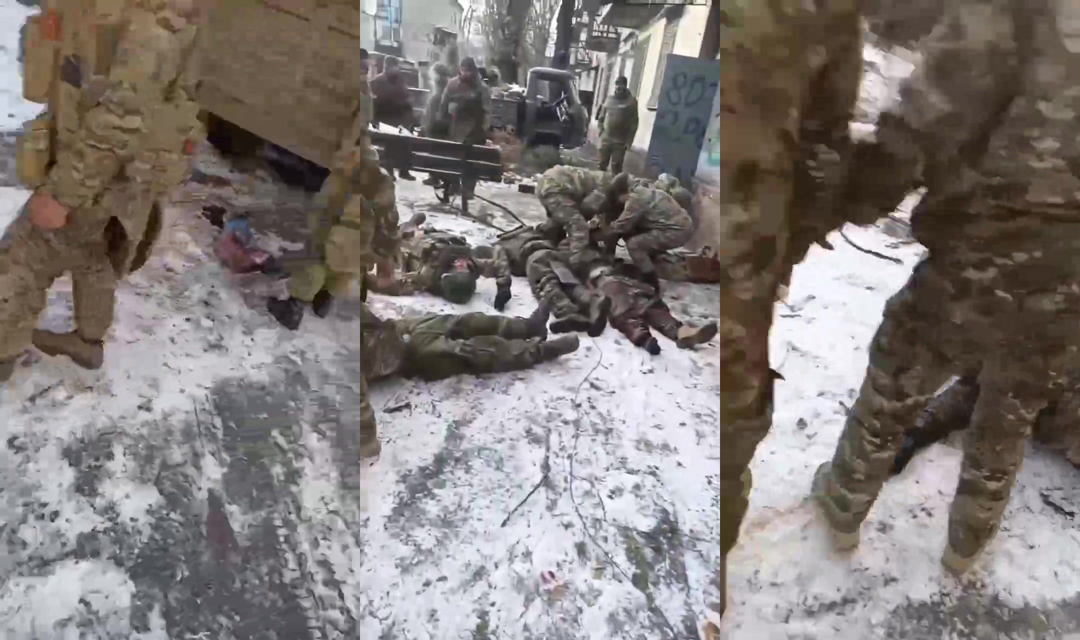 A Russian soldier is showing his dead friends