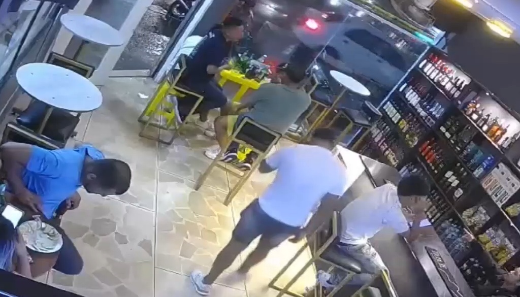 Assassins Open Fire at the Bar Entrance Killing One and Injuring Four