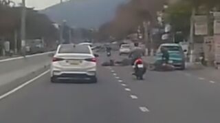 Rider Hit By Car Door, And Ran Over By Another Two Wheeler