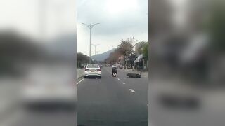 Rider Hit By Car Door, And Ran Over By Another Two Wheeler