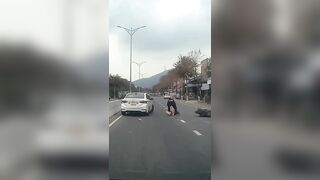 Rider Hit By Car Door, And Ran Over By Another Two Wheeler