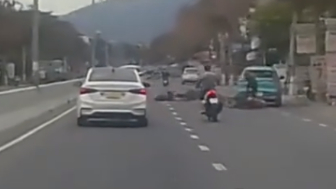 Rider Hit By Car Door, And Ran Over By Another Two Wheeler