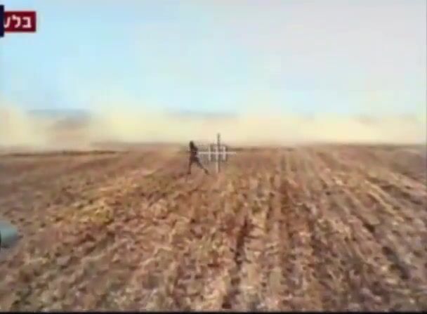 Israeli Merkava fires and runs over a Hamas fighter