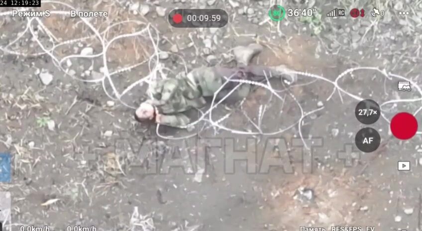A Russian soldier is trying to kill himself with barbed wire