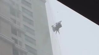 Window Washer, Still Attached to His Safety Harness, Slams Against High-rise