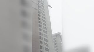 Window Washer, Still Attached to His Safety Harness, Slams Against High-rise