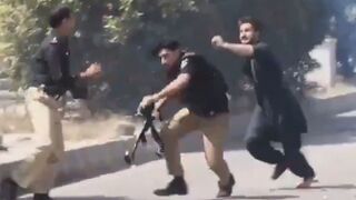 Fearless Idiot Attacks Police Officers During Protest And Gets Clubbed