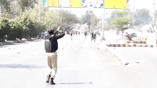 Fearless Idiot Attacks Police Officers During Protest And Gets Clubbed