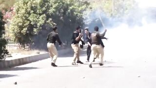Fearless Idiot Attacks Police Officers During Protest And Gets Clubbed