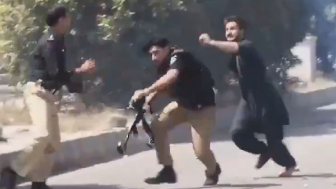 Fearless Idiot Attacks Police Officers During Protest And Gets Clubbed