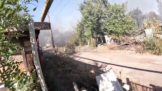 Ukrainian soldier holding long security along road kills Russian soldier