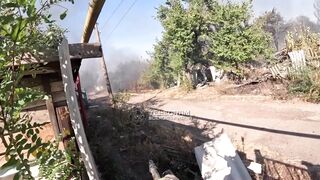 Ukrainian soldier holding long security along road kills Russian soldier