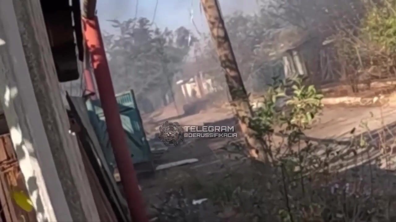 Ukrainian soldier holding long security along road kills Russian soldier