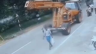 Pedestrian Gets His Head Popped By Crane
