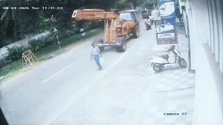 Pedestrian Gets His Head Popped By Crane