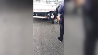 Motorcyclist VS Parked Truck, Truck Won