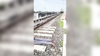 Decapitated Man Lying On Tracks As Trains Pass By