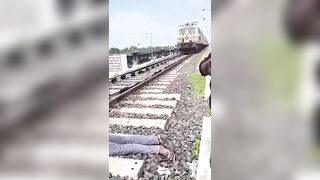 Decapitated Man Lying On Tracks As Trains Pass By