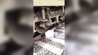 Decapitated Man Lying On Tracks As Trains Pass By