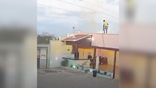 Man Working On Roff Contacts Live Wire, Gets Lectrocuted