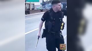 Man Unfazed By Police Batons
