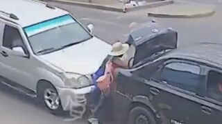 Woman Loading Trunk Mid-Road Struck by Vehicle In Peru