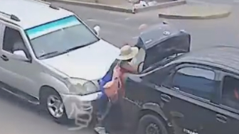 Woman Loading Trunk Mid-Road Struck by Vehicle In Peru