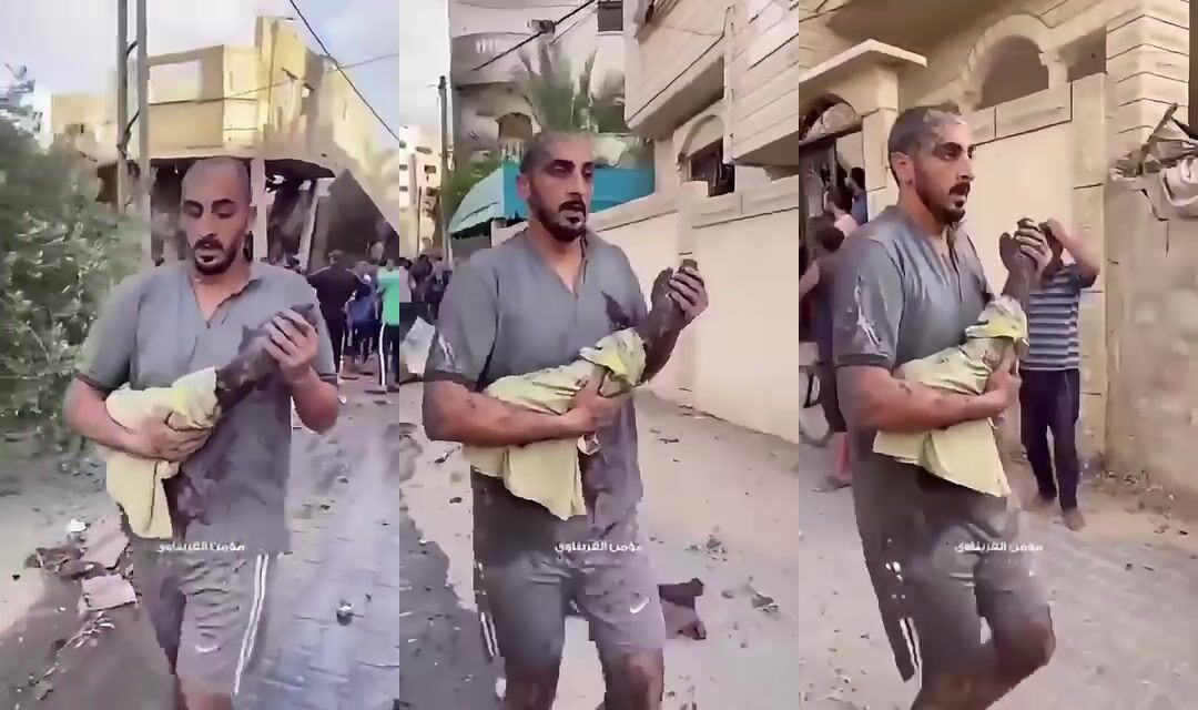 MAN WALKS WITH ONE ARM IN HIS HANDS