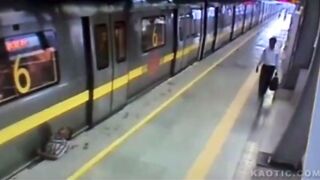 Man stands on tracks, ends up getting crushed between the train and a platform(CLASSIC)
