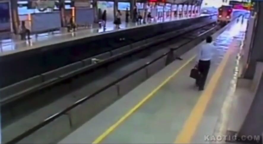 Man stands on tracks, ends up getting crushed between the train and a platform(CLASSIC)