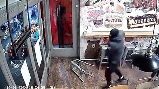 Two Man Fights With A Sword Inside Shop